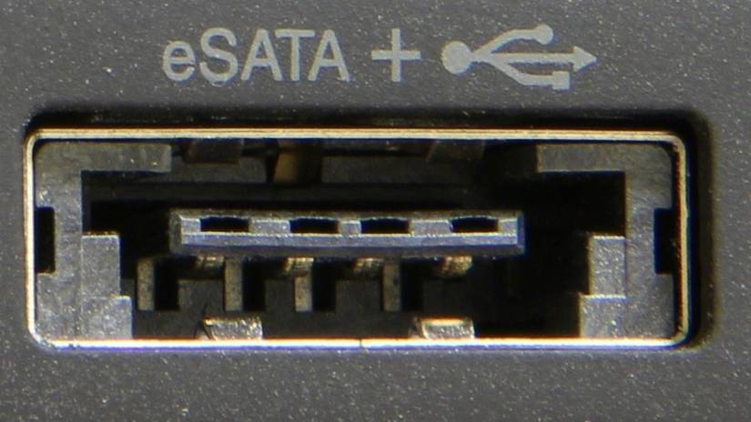 A close-up of the eSATA port on a laptop.