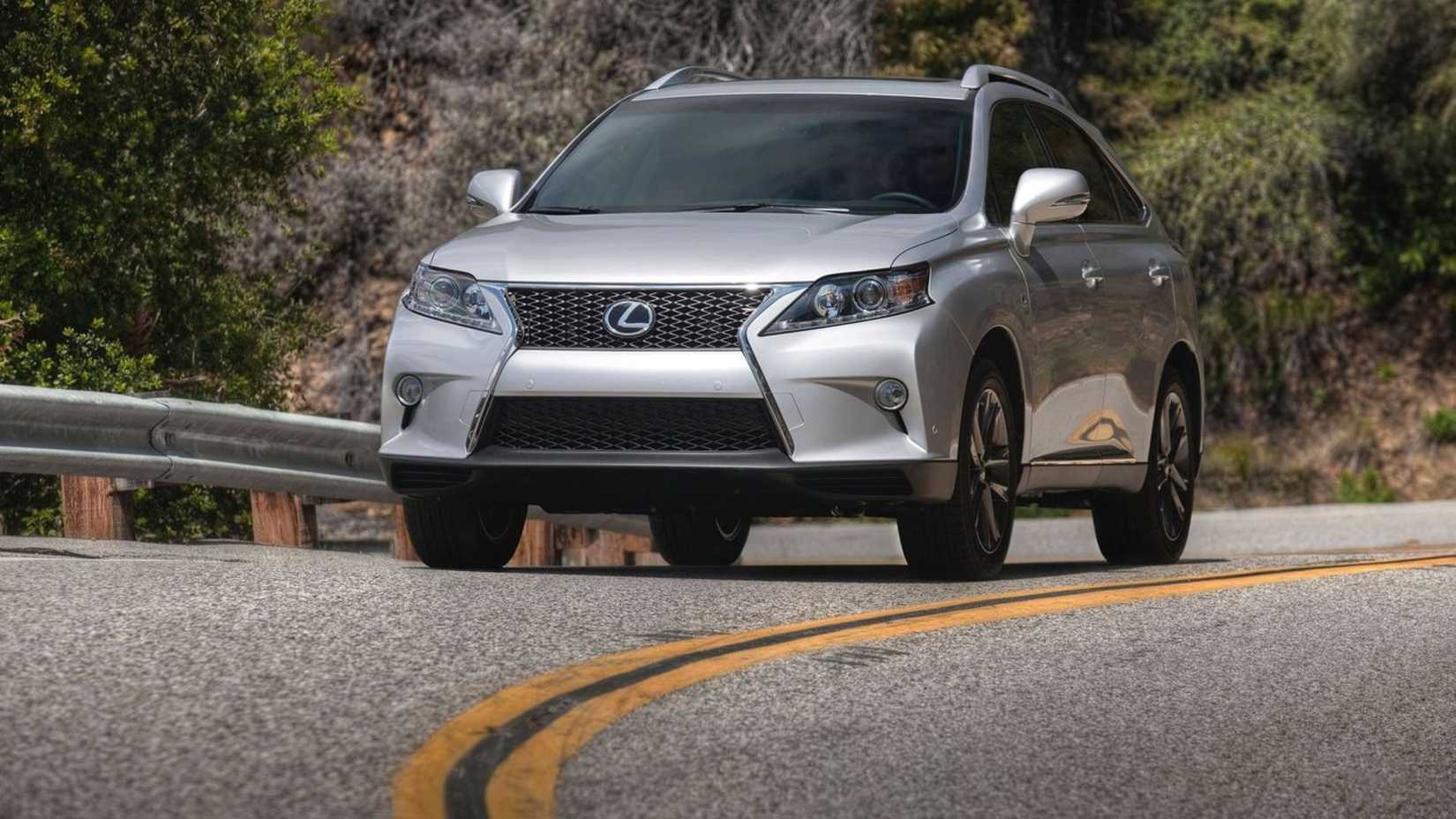 Dynamic 3/4 view of a silver 2013 Lexus RX 350 F Sport.