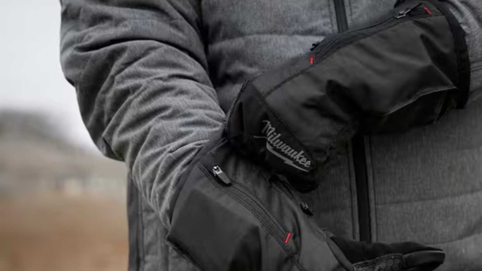 Milwaukee heated gloves on a person
