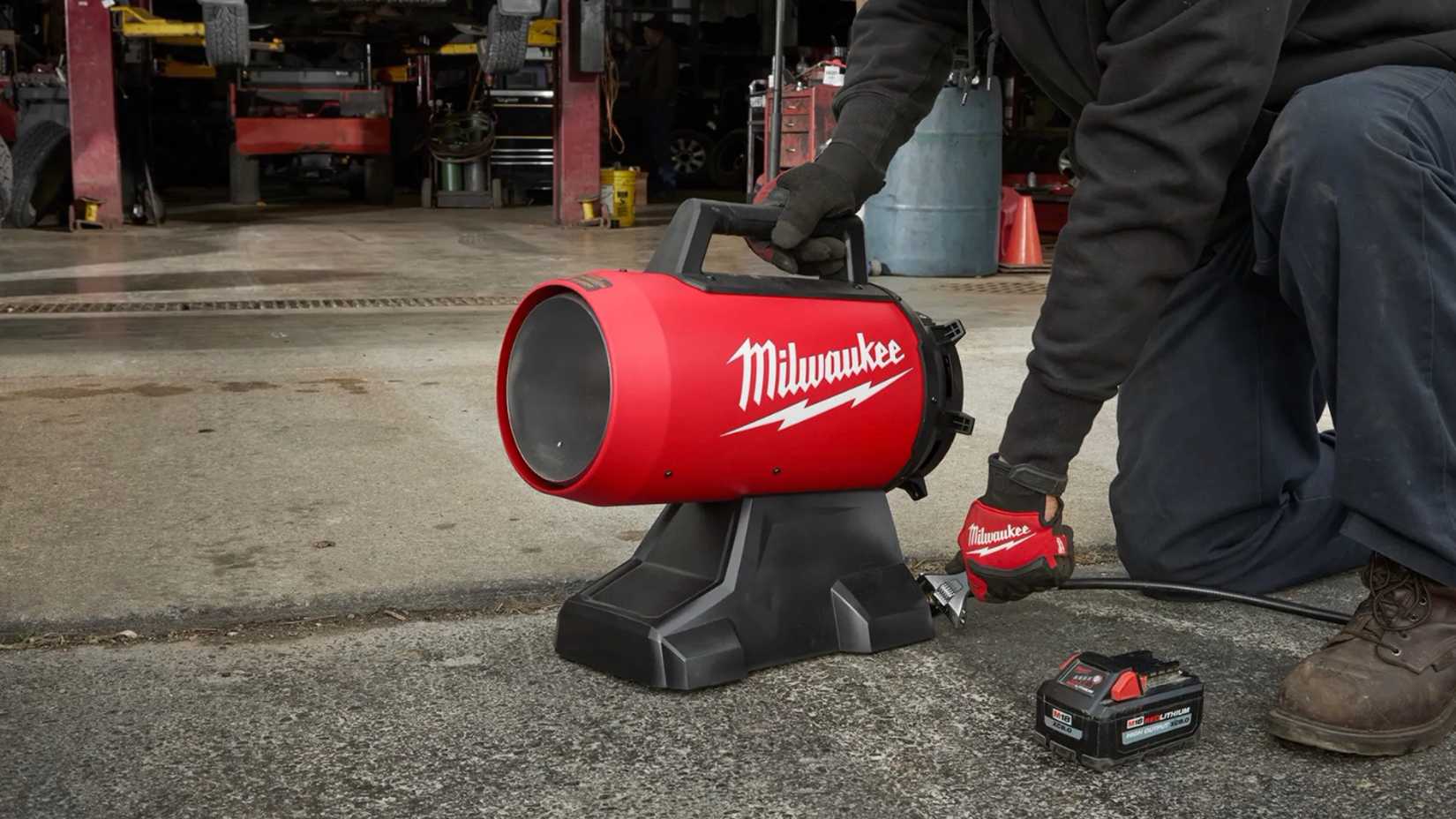 Milwaukee propane heater in a car shop garage