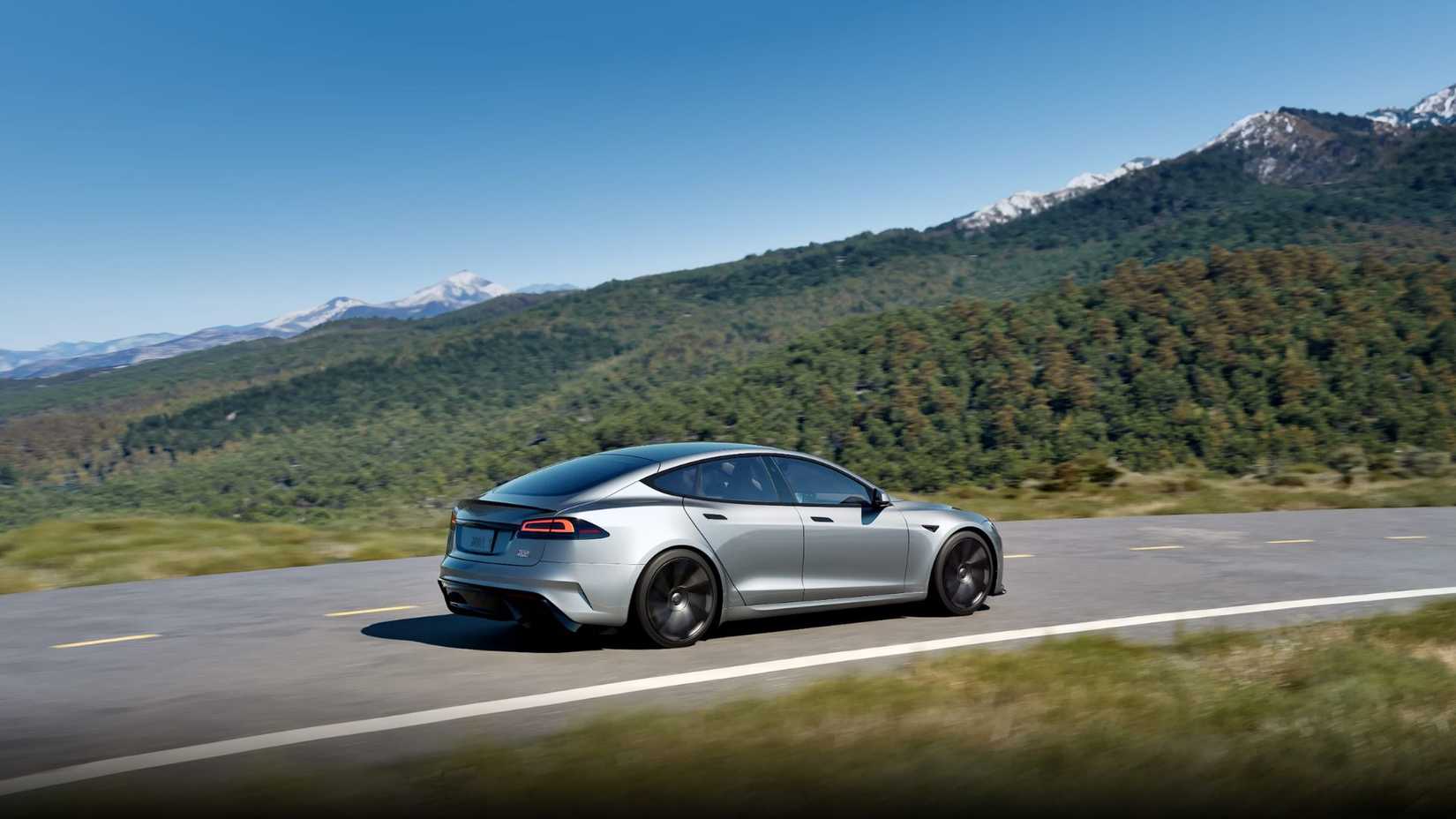 Dynamic shot of a gray 2026 Tesla Model S Plaid in 3/4 scale.