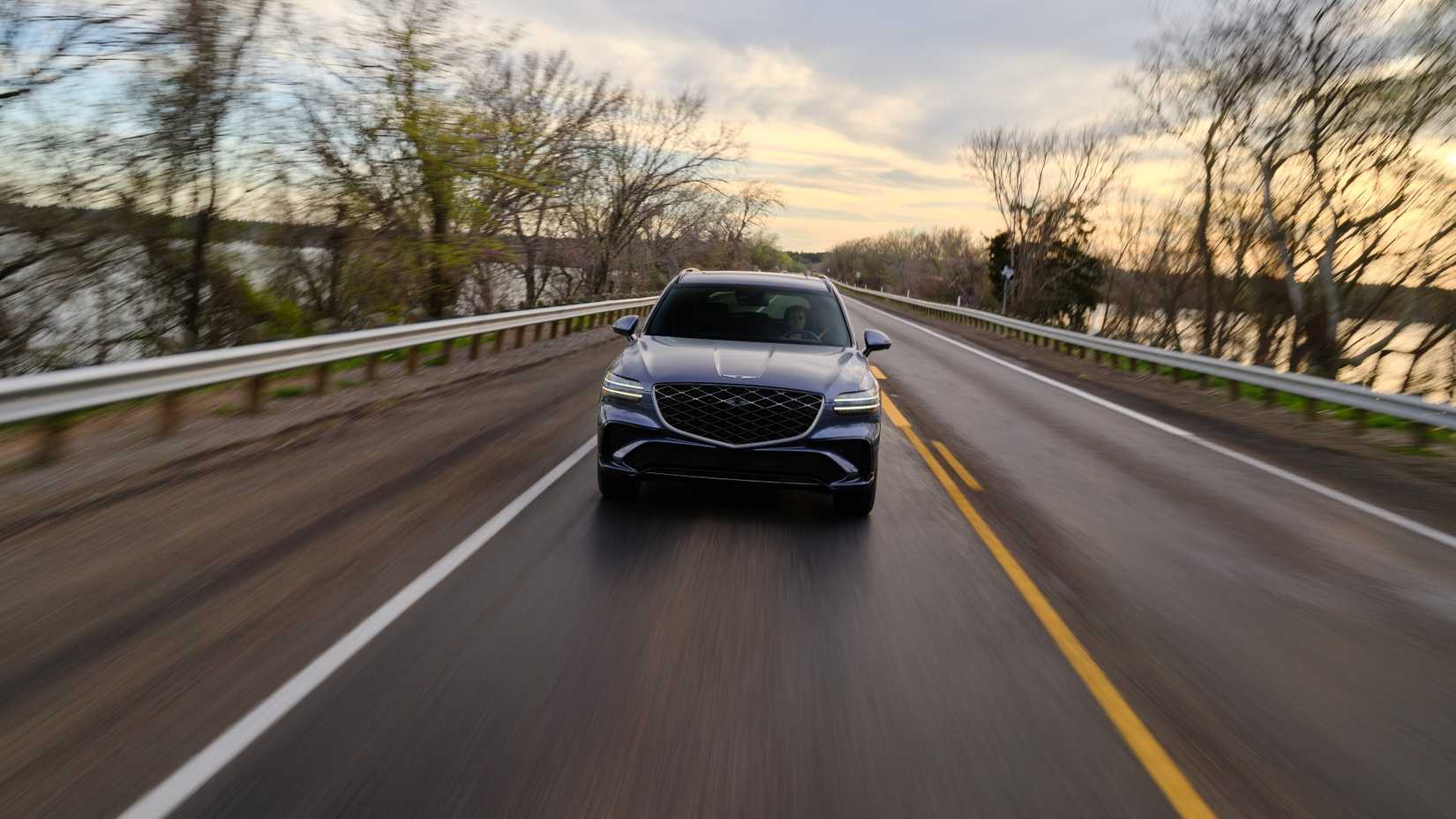 Head-on action shot of a 2026 Genesis GV70 