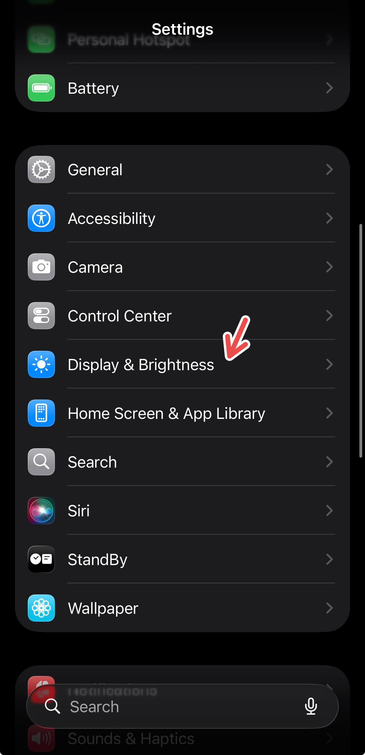 An iPhone screenshot with a red arrow pointing to 