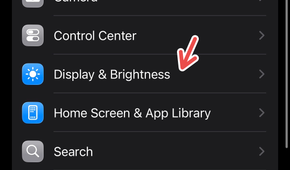 An iPhone screenshot with a red arrow pointing to