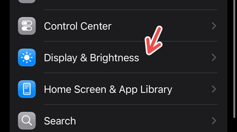 An iPhone screenshot with a red arrow pointing to