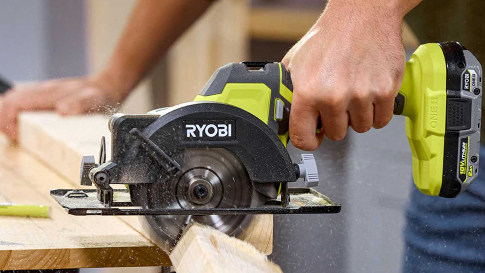 person using Ryobi cutoff saw