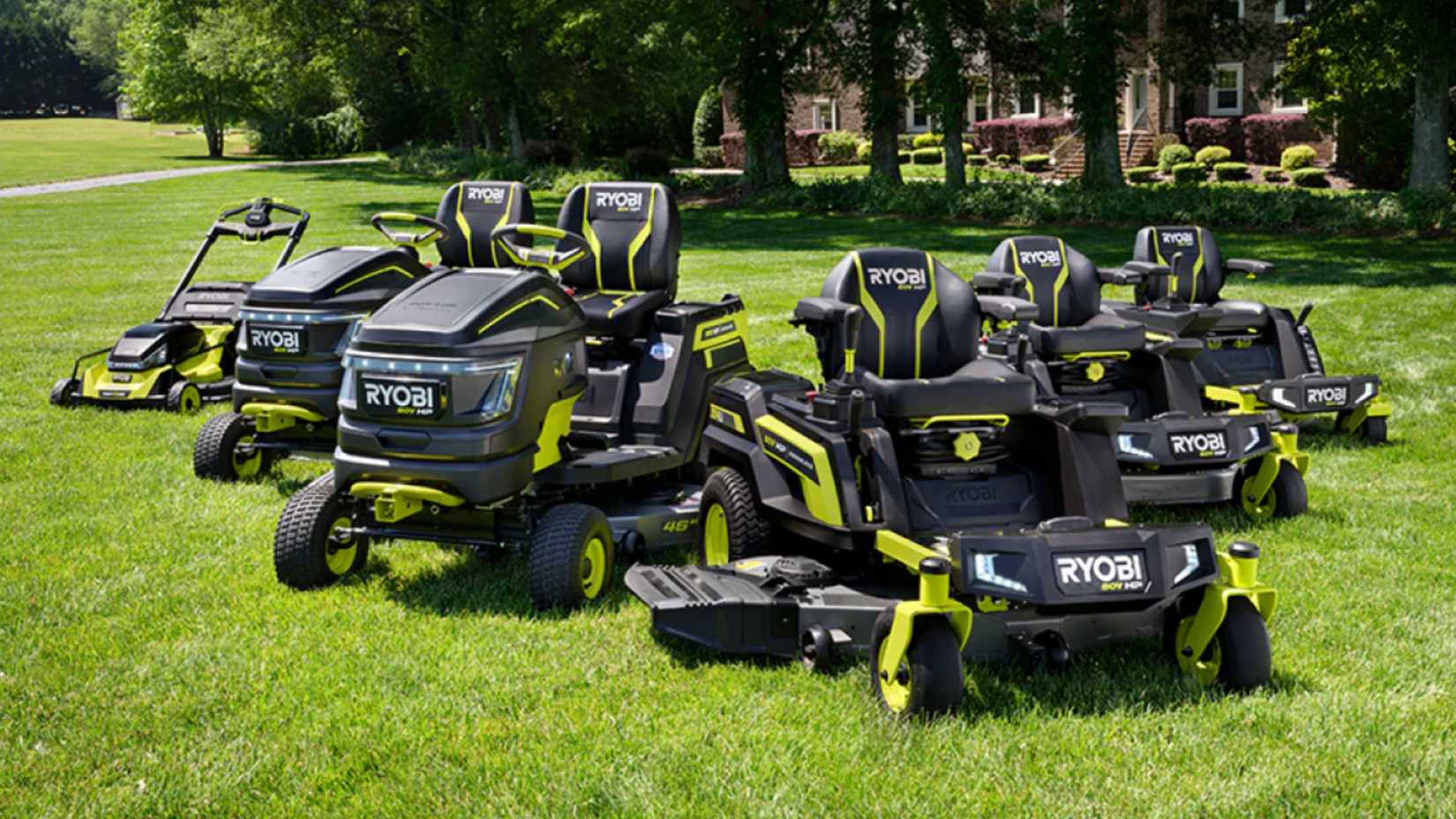 Ryobi 80v lawn mowers in front of a house. 