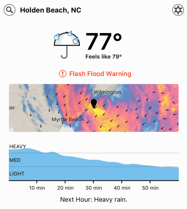 The home screen of the Dark Sky app showing a radar map and rainfall chart.