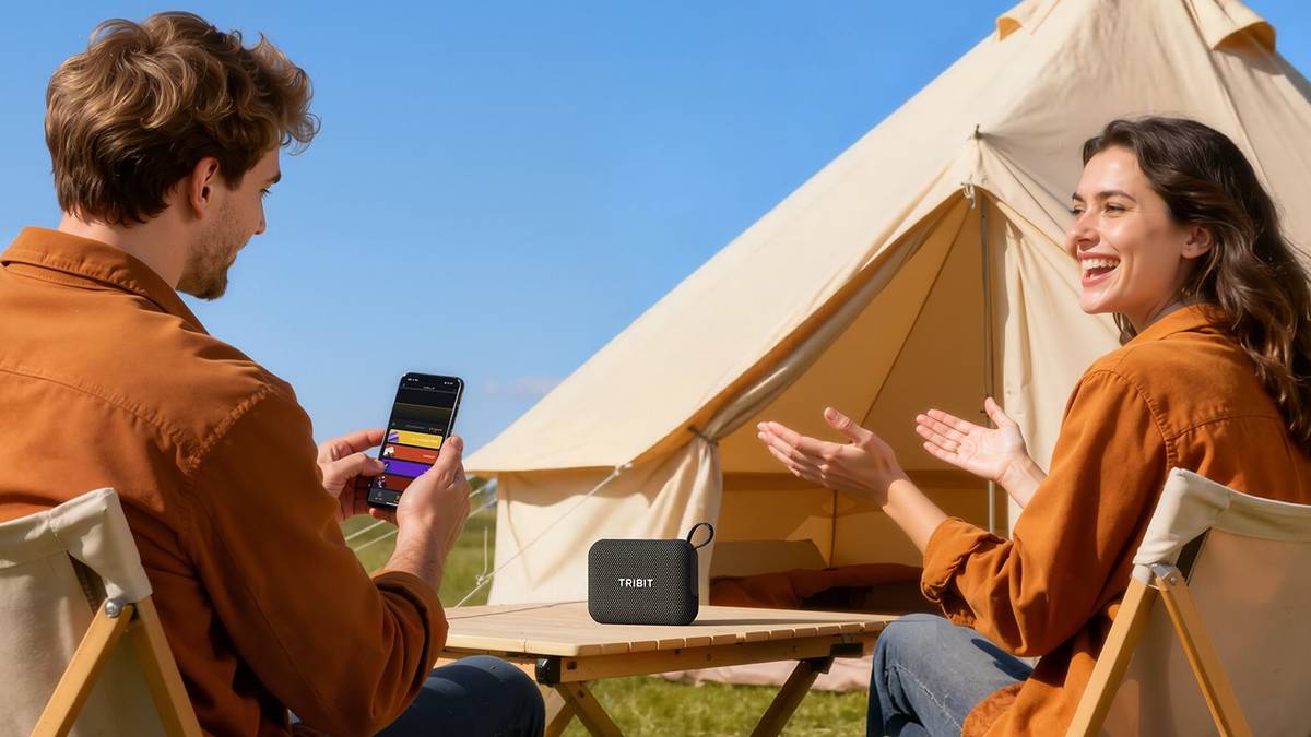 man and a woman camping with the Tribit PocketGO on the table between them