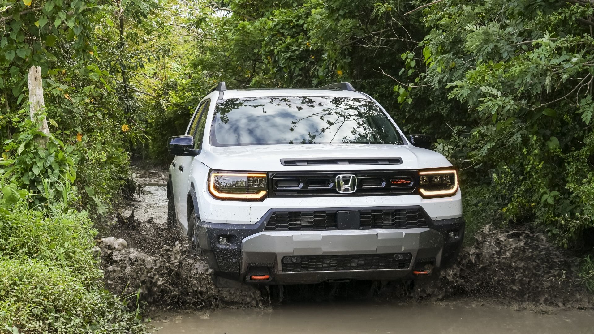 Head-on action shot of a 2026 Honda Passport TrailSport Elite