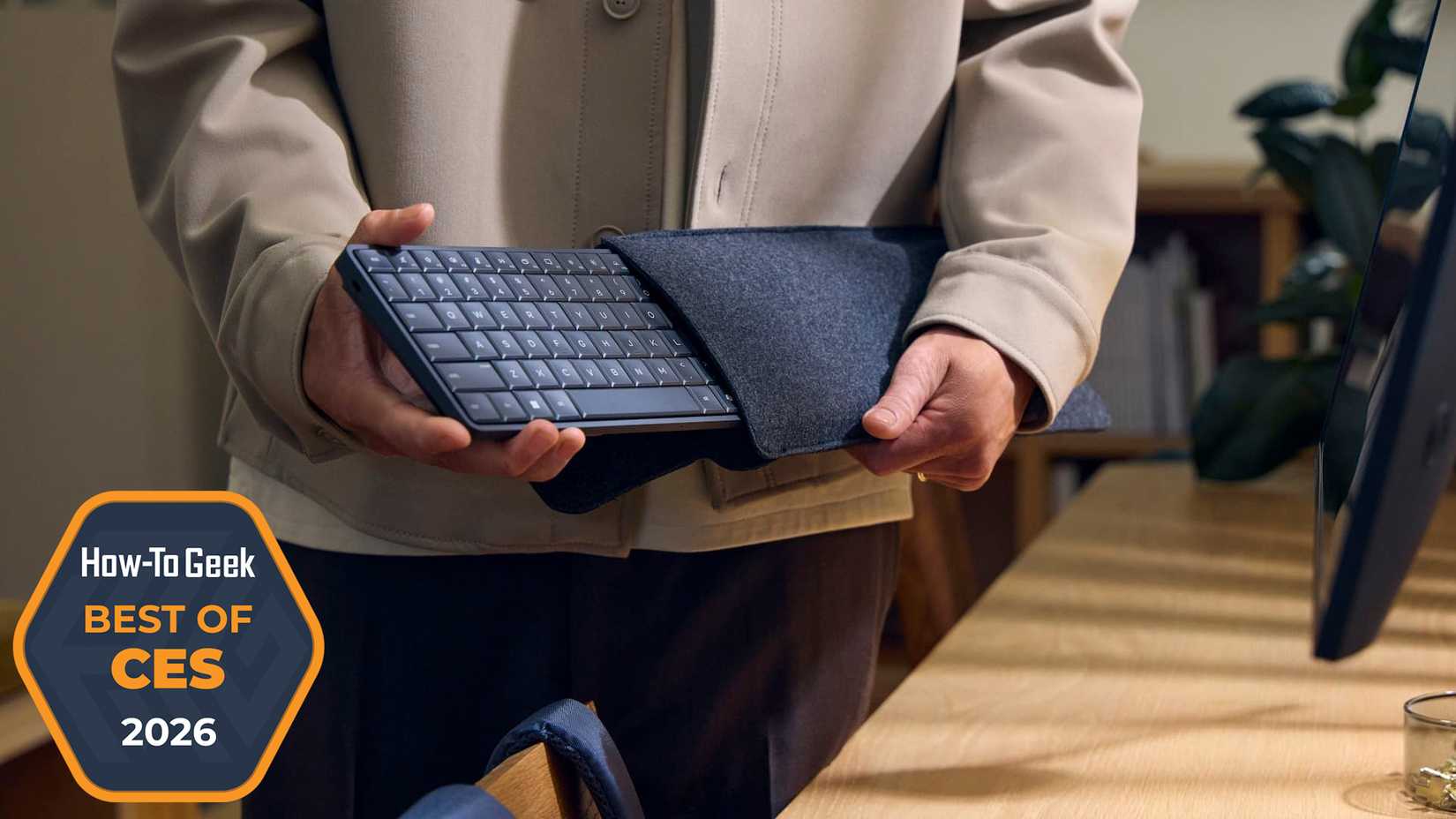 Person holding the HP EliteBoard G1a Next Gen AI PC.
