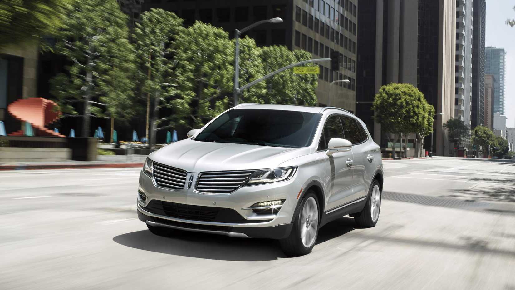 Dynamic front 3/4 shot of a silver 2016 Lincoln MKC.