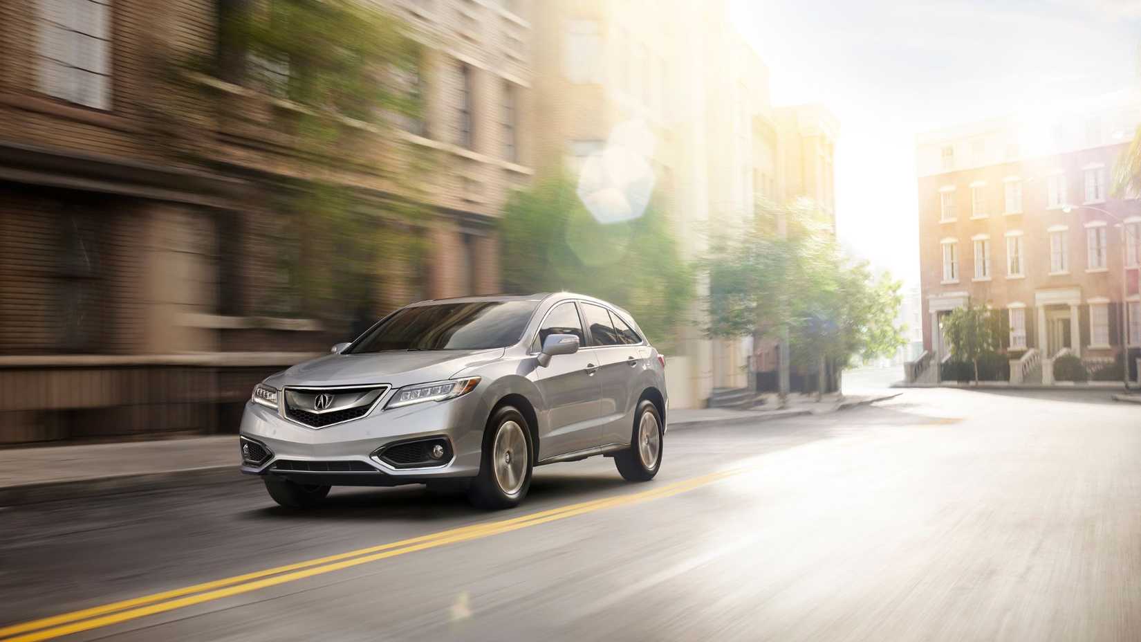 Dynamic front 3/4 shot of a silver 2018 Acura RDX.