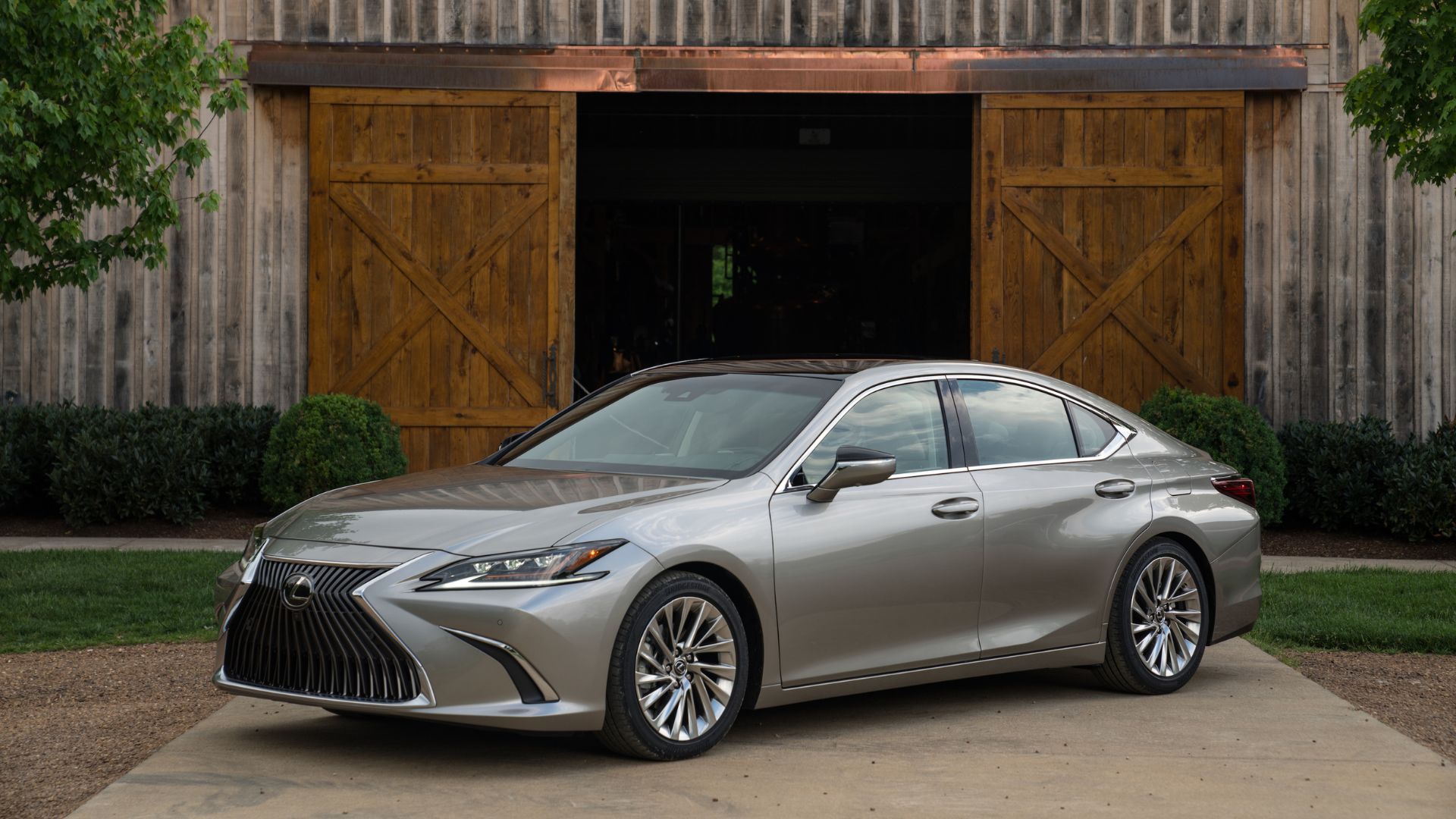 Static front 3/4 shot of a gray 2019 Lexus ES 300h.