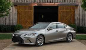 Static front 3/4 shot of a gray 2019 Lexus ES 300h.