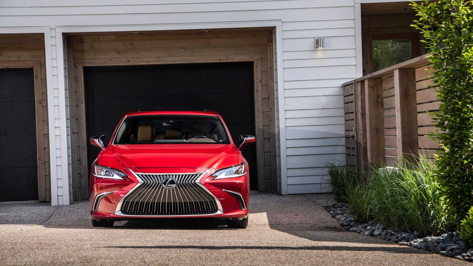 Static front-end shot of a red 2019 Lexus ES 300h.
