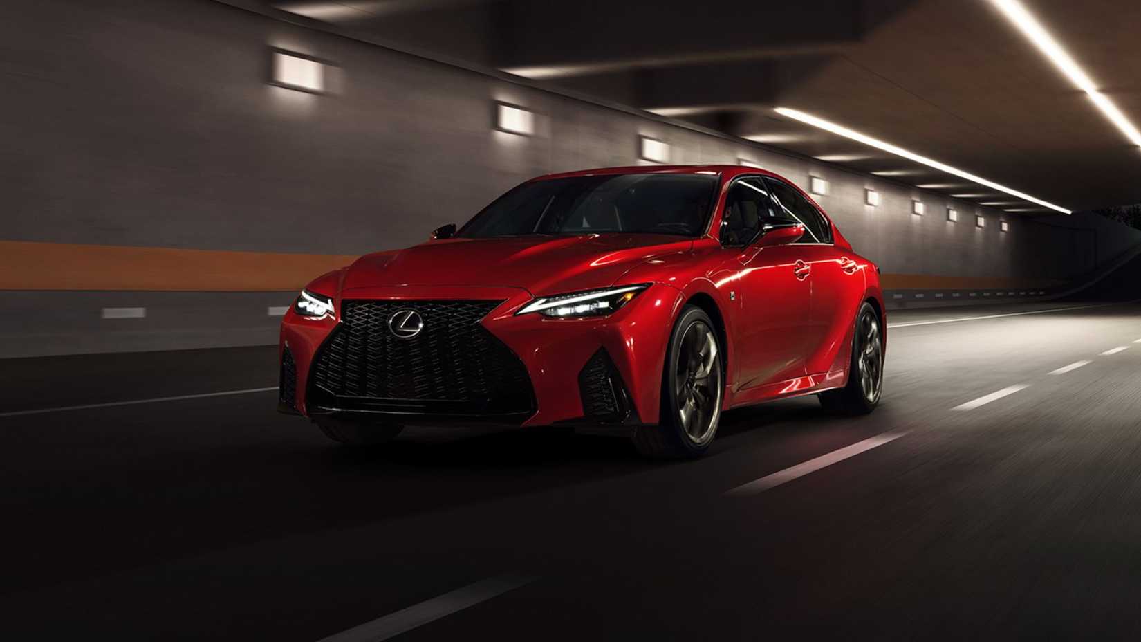 Dynamic front 3/4 shot of a red 2024 Lexus IS 500 F SPORT PERFORMANCE Premium.