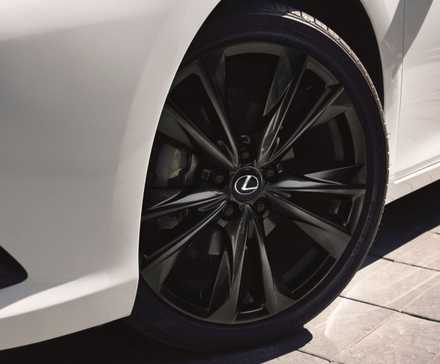 Close-up shot of the alloy wheel on a white 2025 Lexus ES 350.