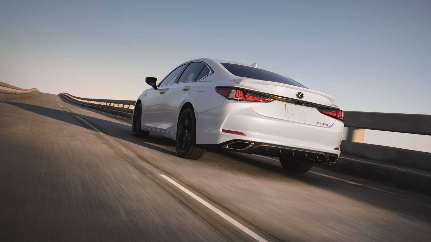 Dynamic rear 3/4 shot of a white 2025 Lexus ES 350.