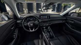 2026 Honda Accord Tourning interior array showing center console, steering wheel, and infotainment screen.