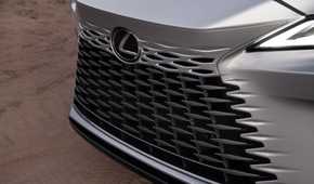 Close-up shot of the front grille on a silver 2026 Lexus RX 350h.