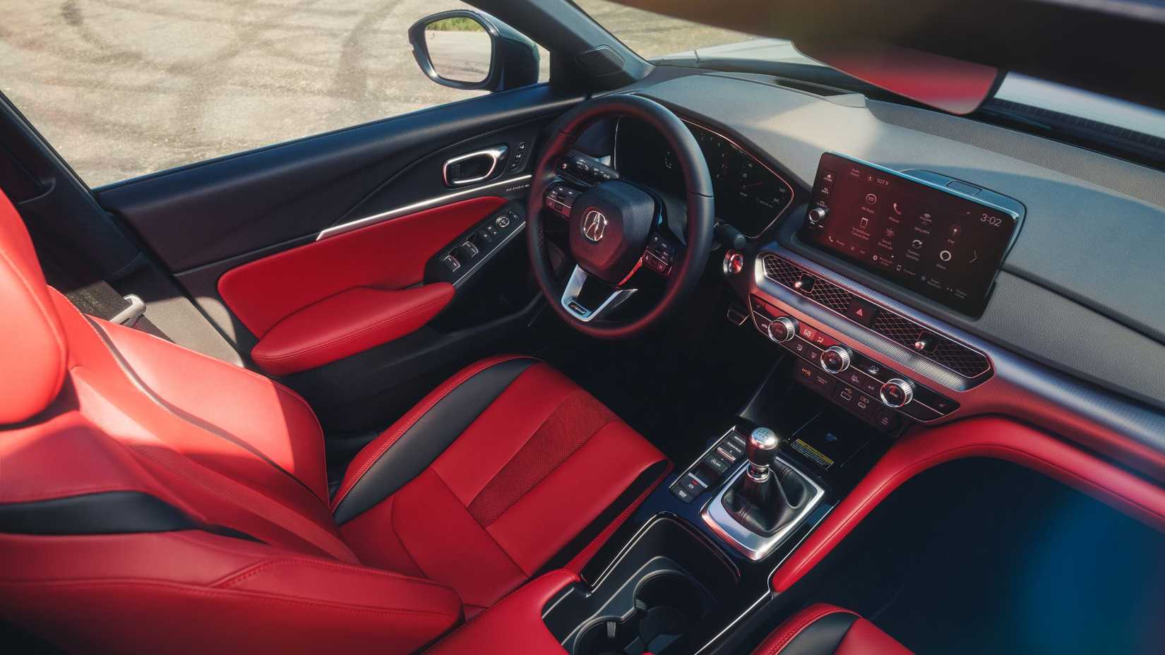 Tomada dentro de la cabina de un Acura Integra A-Spec 2026.