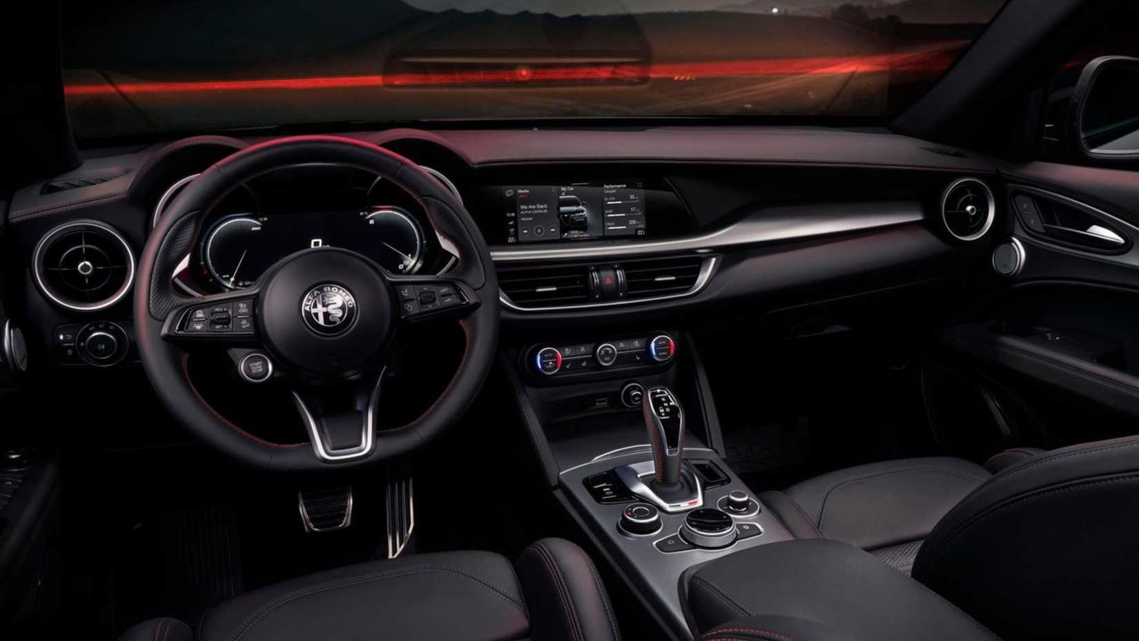 Shot inside the cabin of a 2023 Alfa Romeo Stelvio showing the interior and dashboard.
