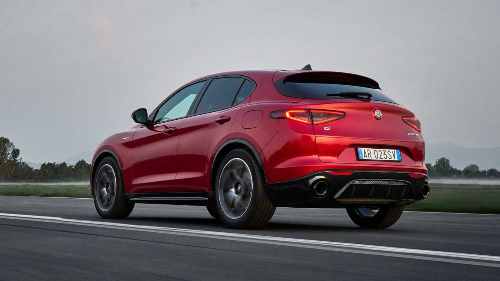 Dynamic rear 3/4 shot of a red 2023 Alfa Romeo Stelvio.