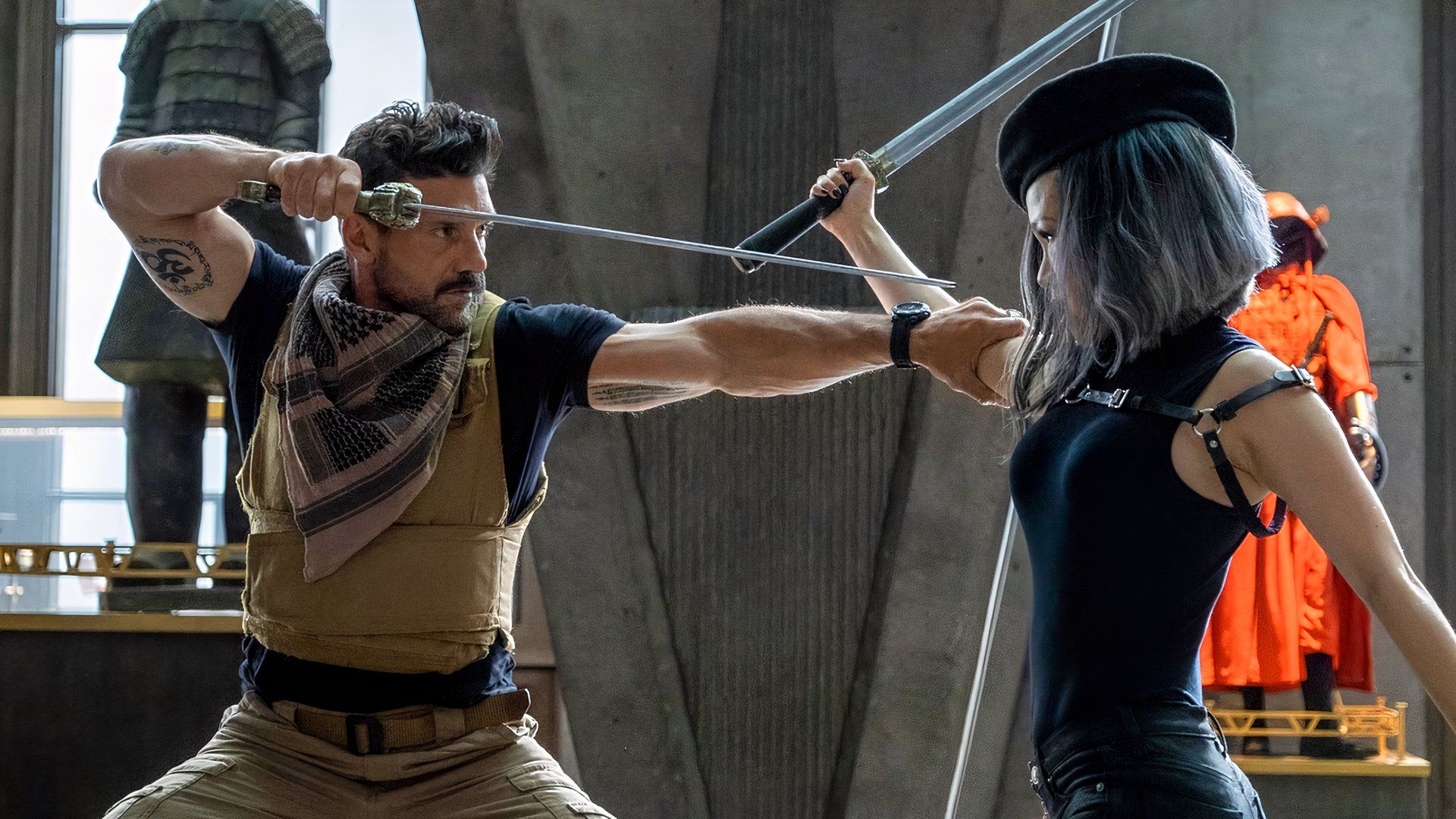 Frank Grillo and Selina Lo fight with swords in Boss Level.