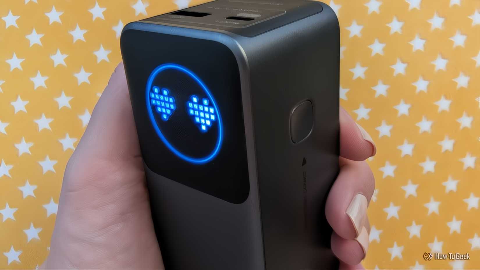 Hand holding a Ugreen Nexode Power Bank 12000mAh