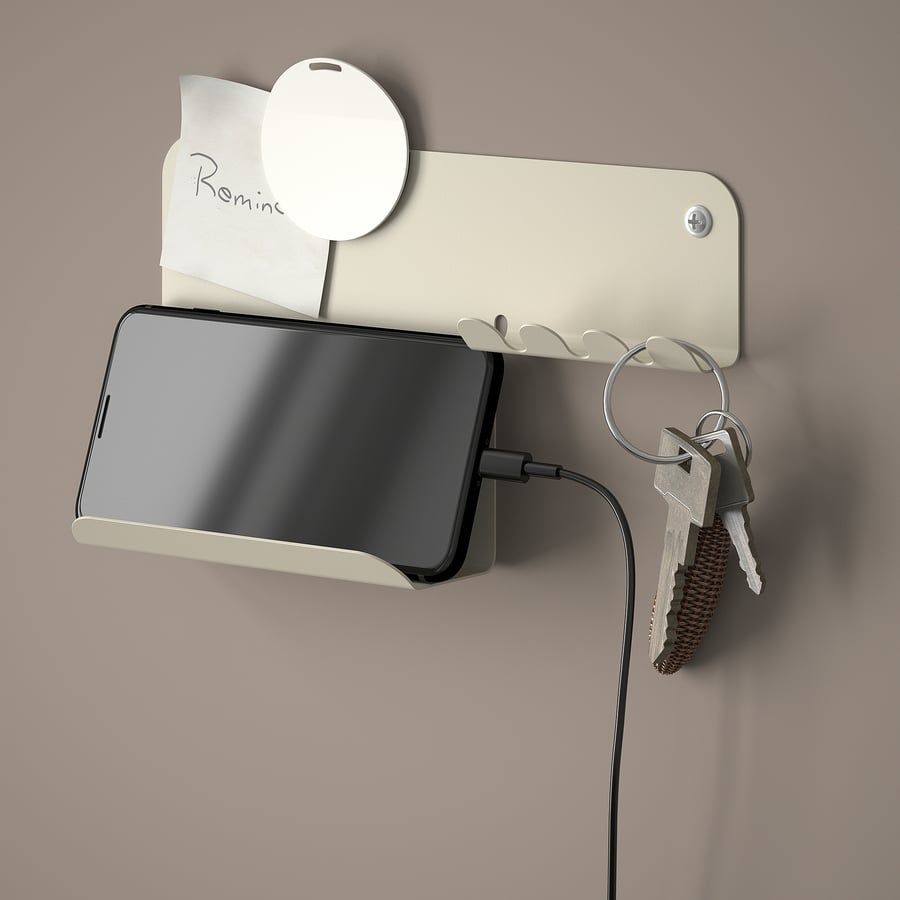 Havrekross wall organizer with a phone and keys.