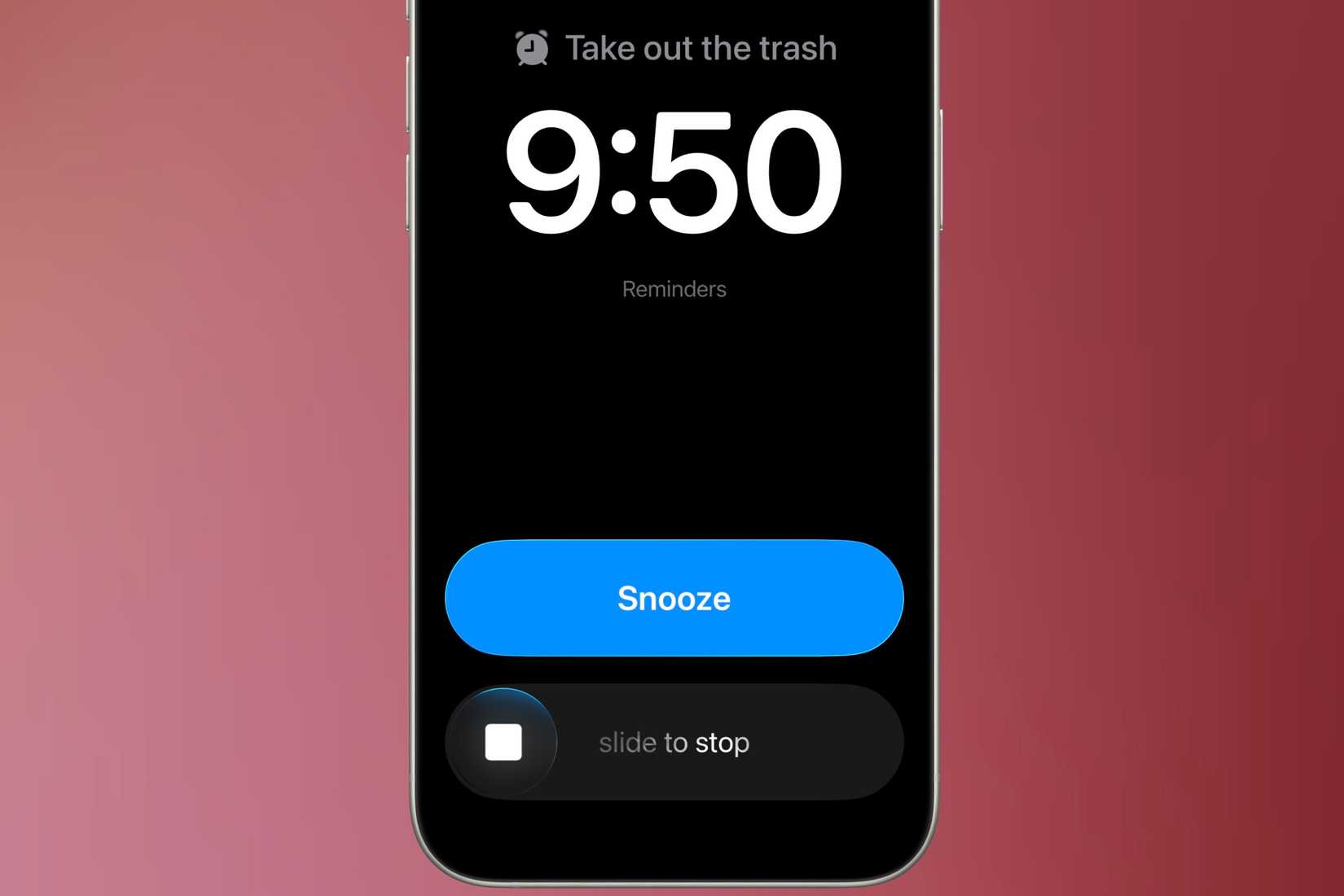 An urgent reminder notification taking up the whole iPhone screen with a "slide to stop" and "snooze" button options available in front of a colorful background.