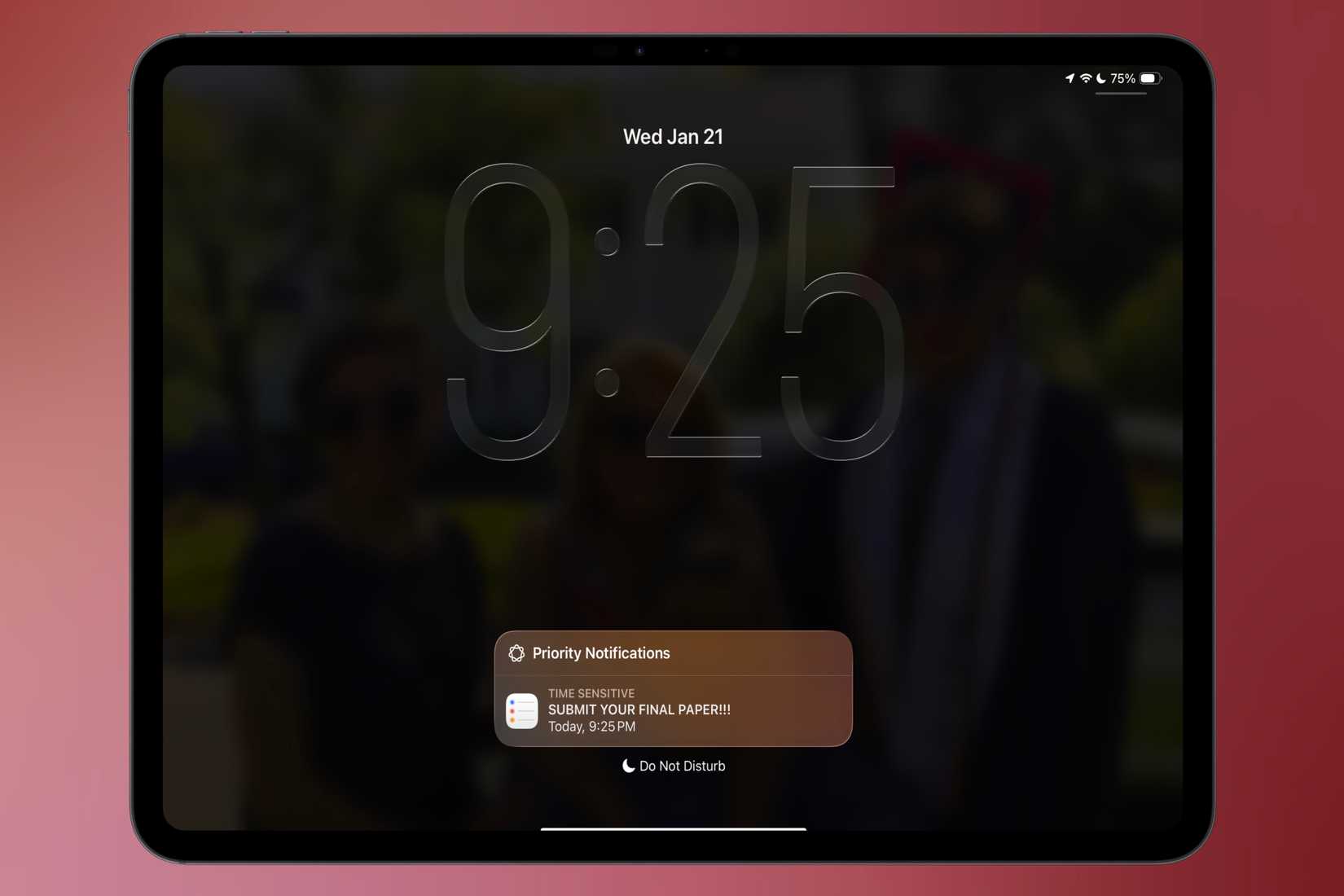 Urgent reminder notification on an iPad lock screen in front of a colorful background.