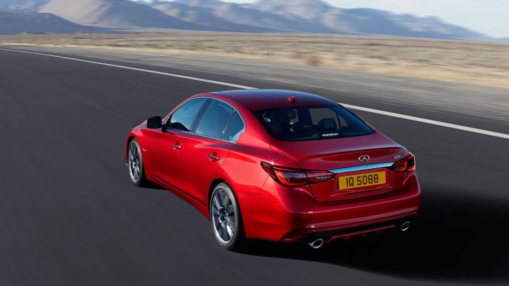 Dynamic rear 3/4 shot of a red 2018 Infiniti Q50.