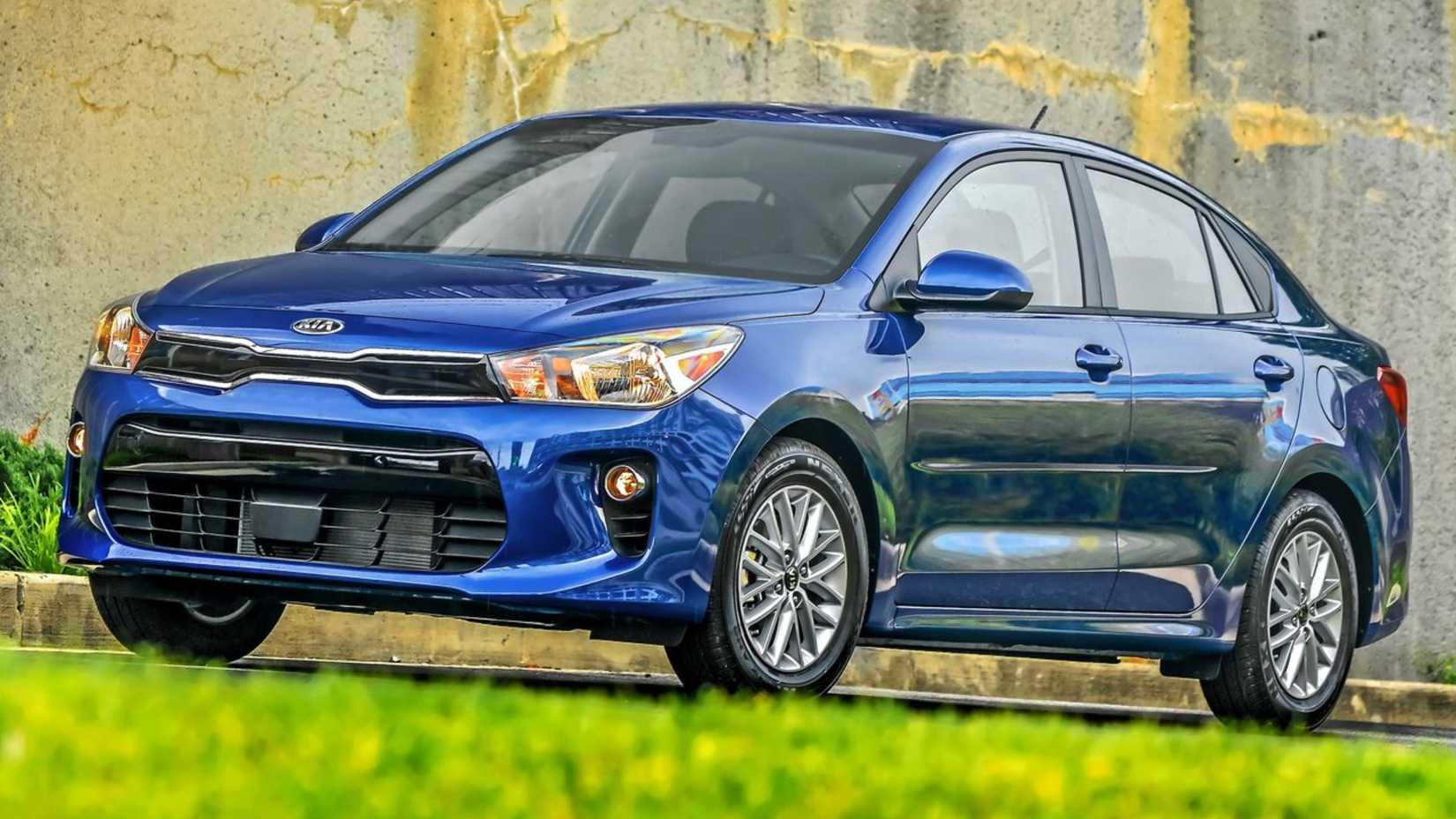 Static front 3/4 shot of a blue 2018 Kia Rio Sedan.