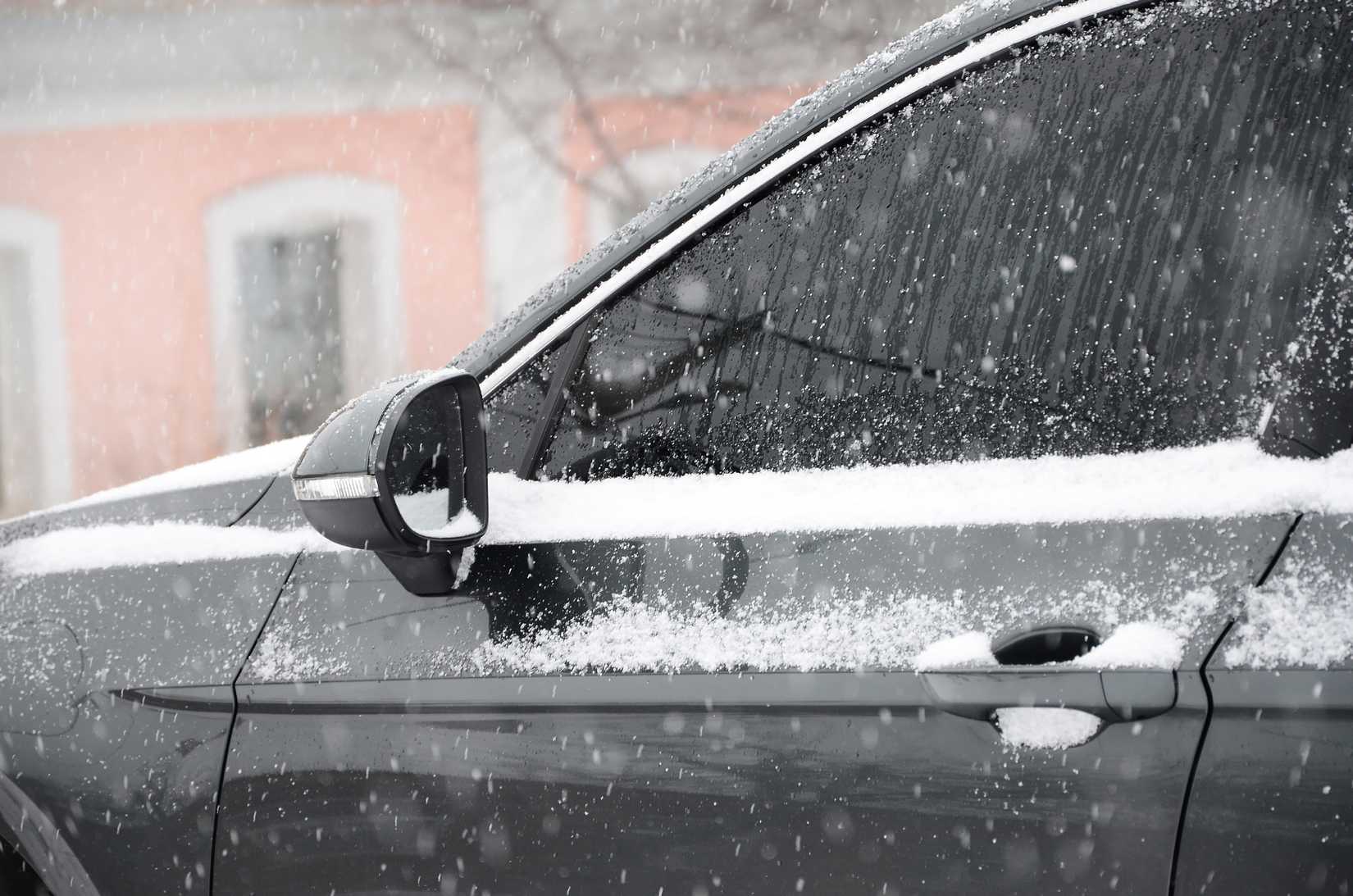 Late-model luxury car parked during the winter