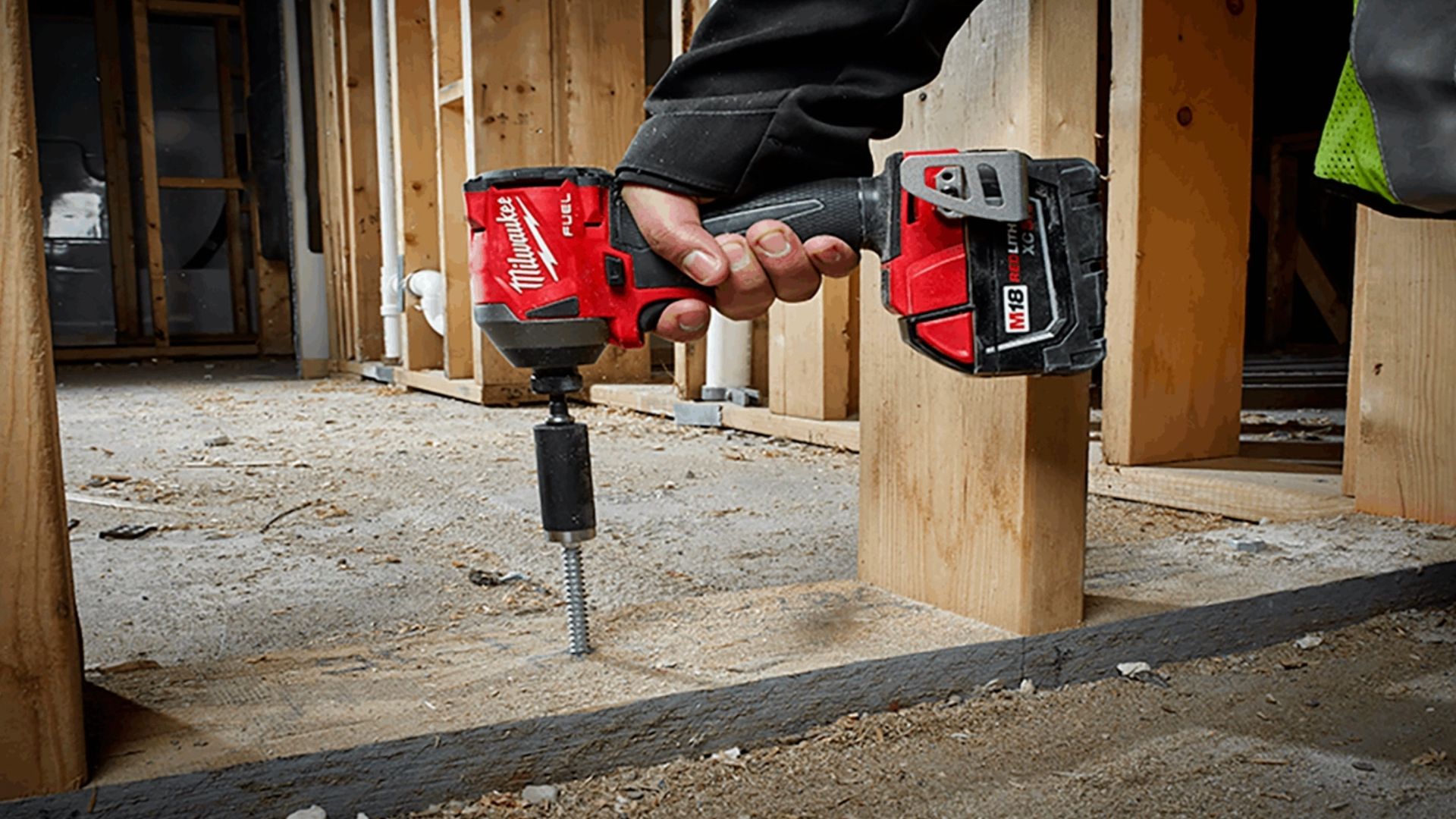 Person using an Milwaukee M18 impact
