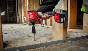 Person using an Milwaukee M18 impact