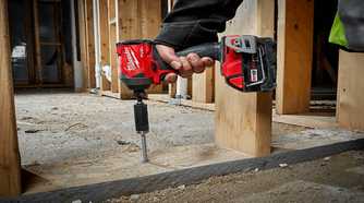 Person using an Milwaukee M18 impact