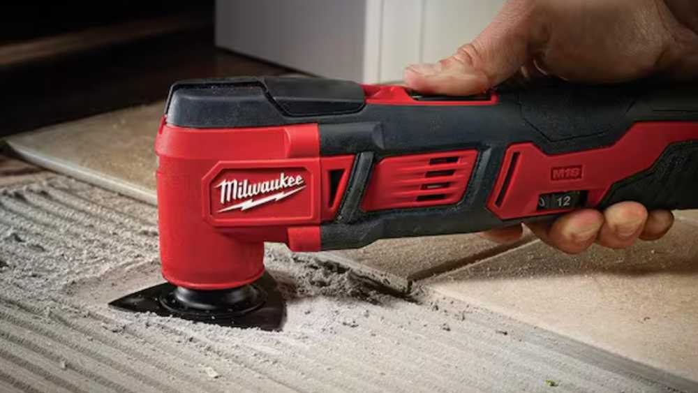 Milwaukee's M18 oscillating tool cutting through tile during renovation work