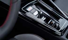 Close-up shot of the gear selector in a 2025 Volkswagen Golf GTI Autobahn.