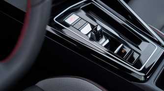 Close-up shot of the gear selector in a 2025 Volkswagen Golf GTI Autobahn.