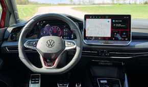 Shot of the steering wheel and infotainment screen in a 2025 Volkswagen Golf GTI Autobahn.
