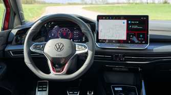 Shot of the steering wheel and infotainment screen in a 2025 Volkswagen Golf GTI Autobahn.