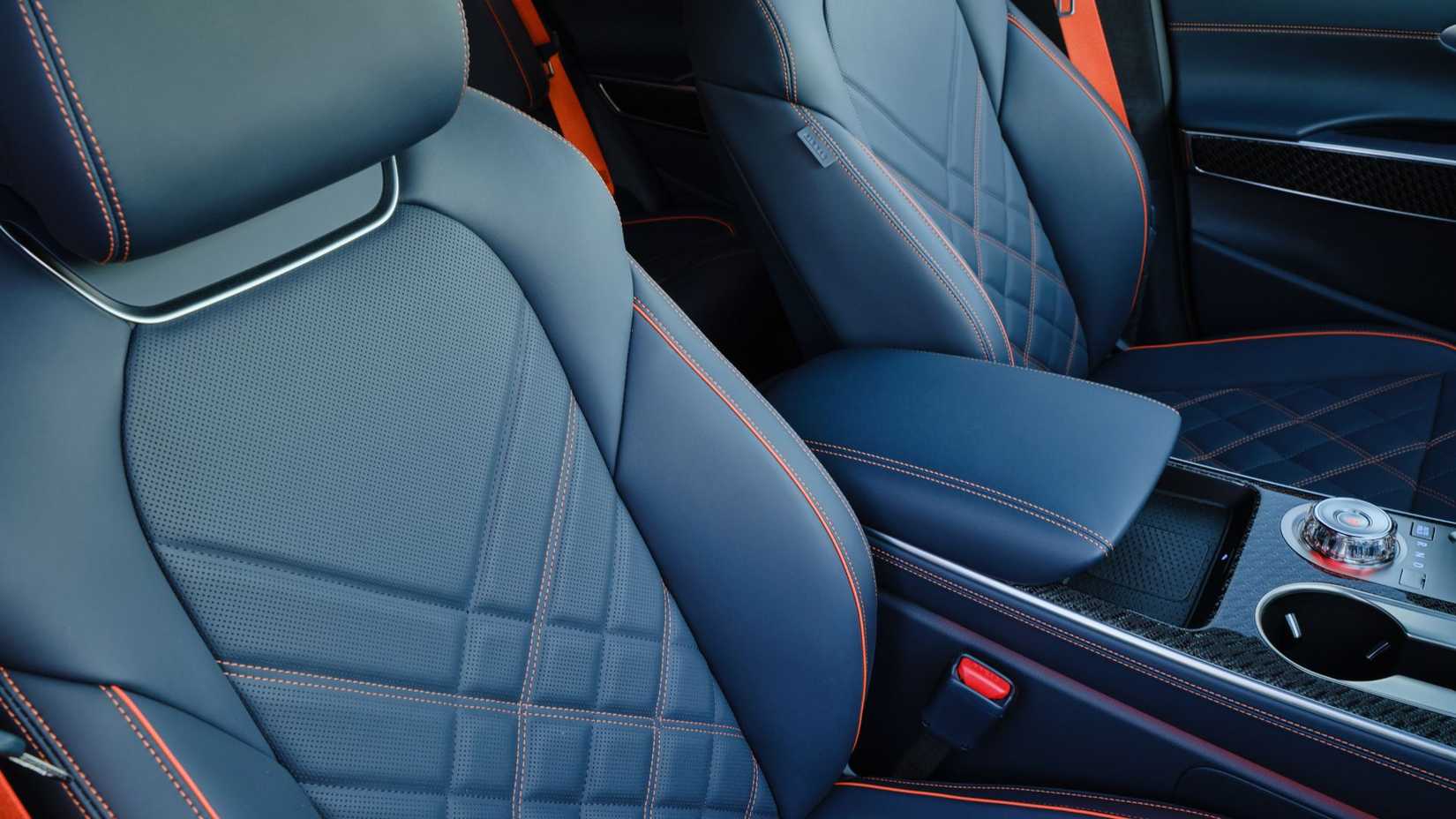 Close-up shot of the black leather seats inside the cabin of a 2026 Genesis GV70.