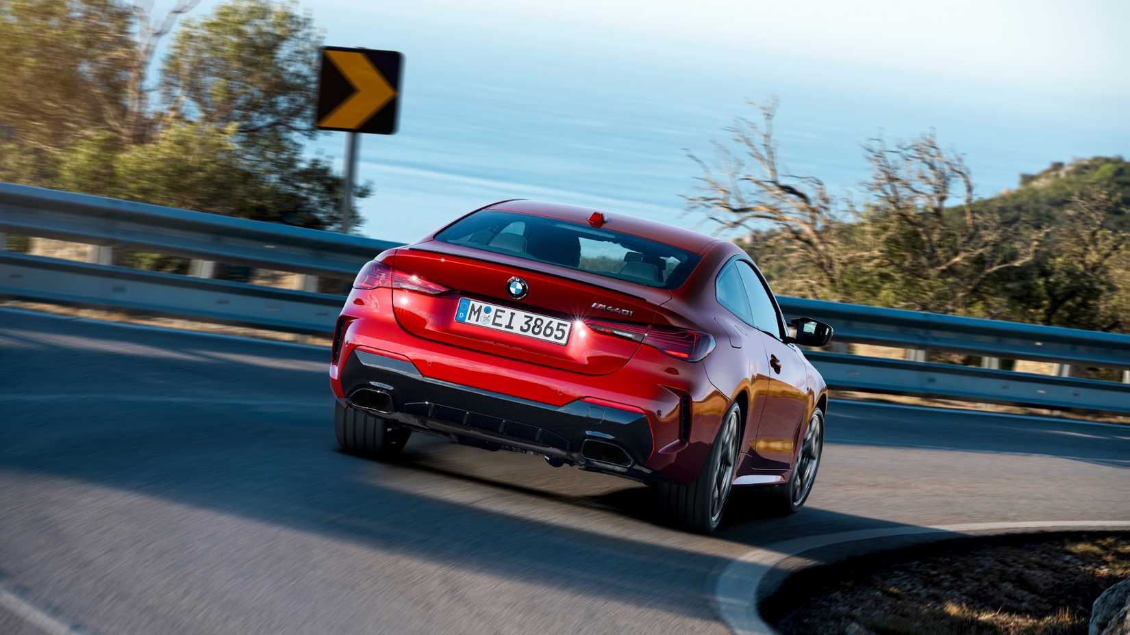 Rear 3/4 action shot of a 2026 BMW 4-Series