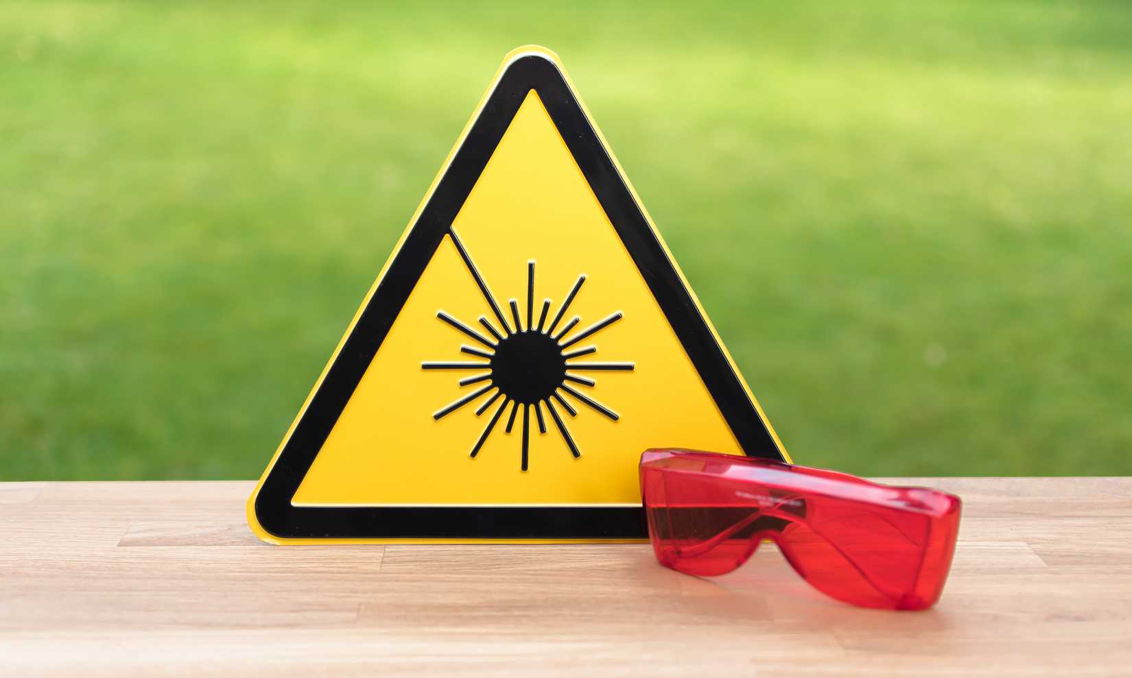 A laser safety sign and glasses.
