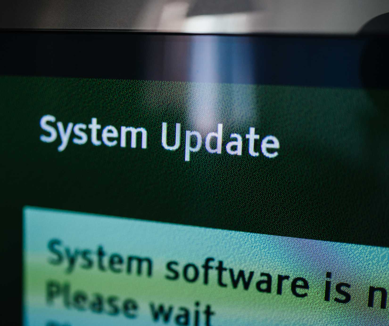 A TV shows a system update pending.