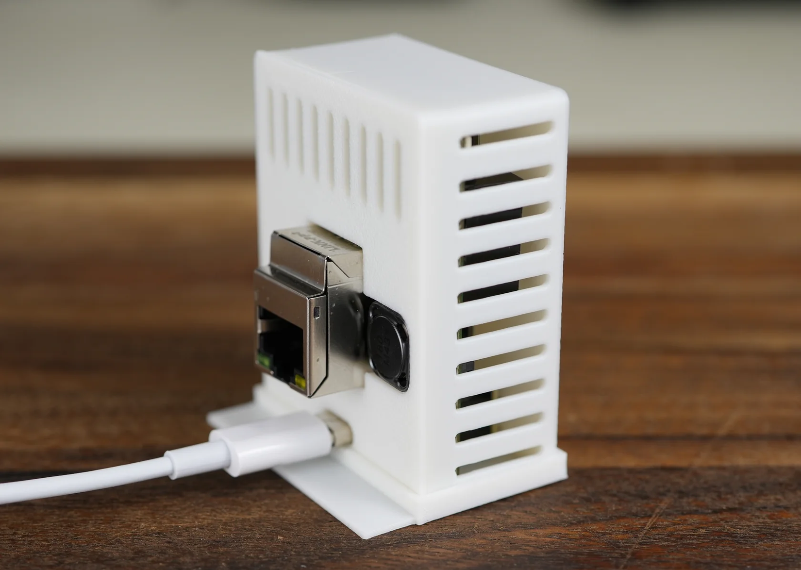 The Apollo Automation R PRO-1 multisensor on a desk.