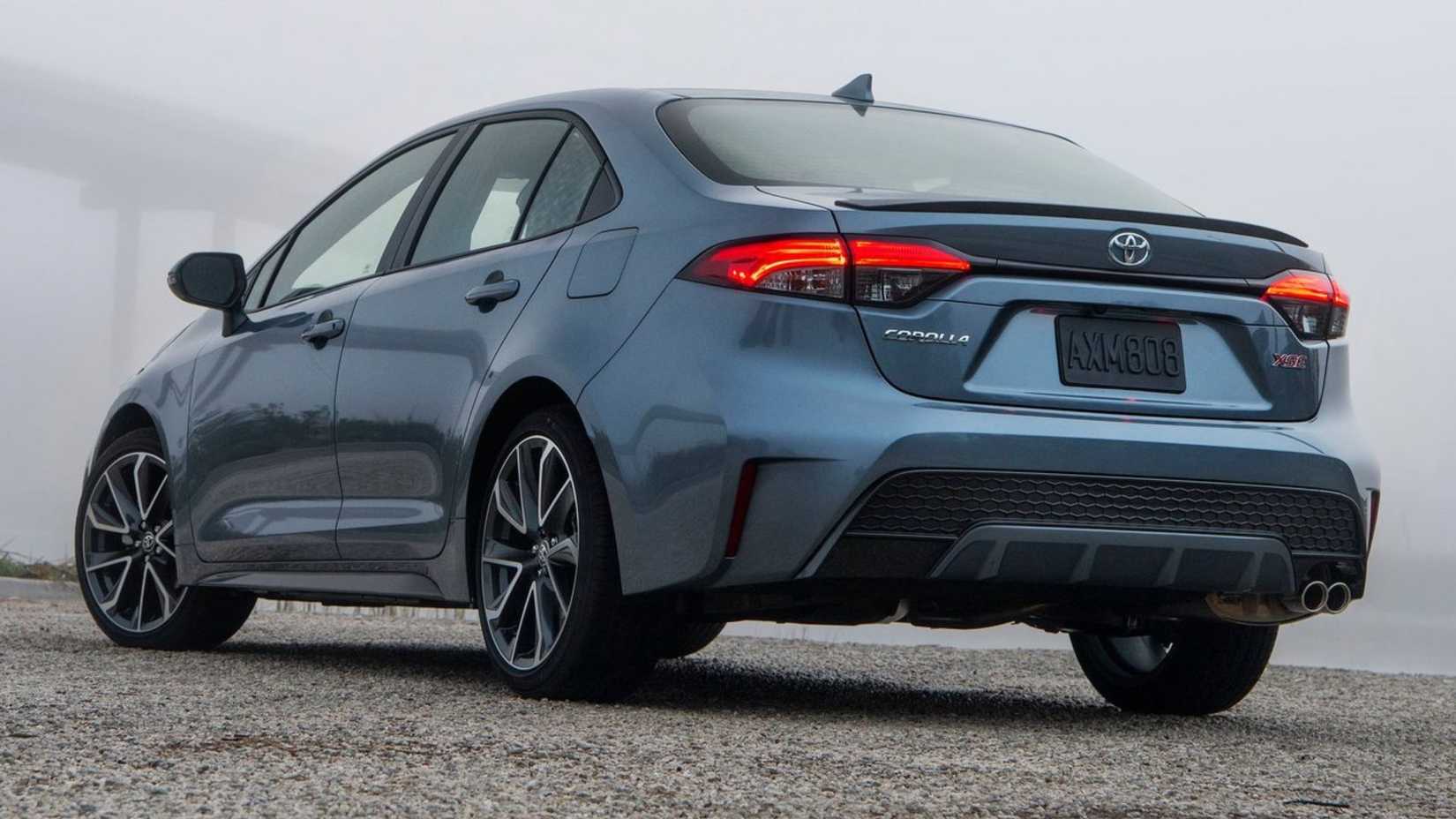 Static rear 3/4 shot of a blue 2020 Toyota Corolla Sedan.
